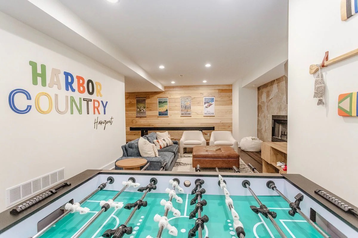 Foosball and lounge area in the completed Ash Harbor House short-term rental game room