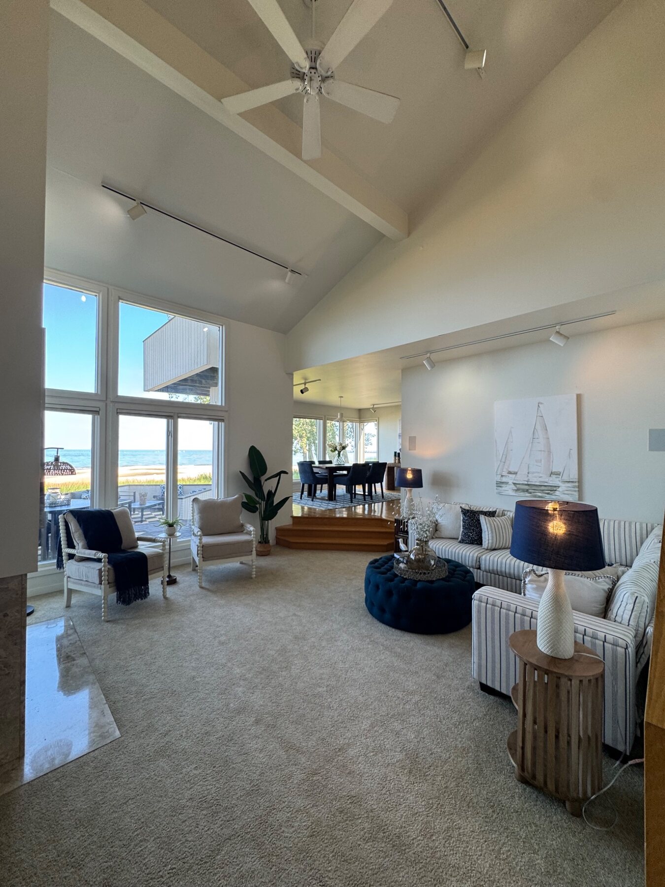 Lake Michigan great room professionally staged in navy, white and warm natural wood